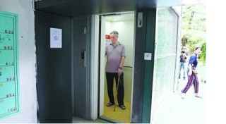 石景山区首部安装老楼加装电梯，提出 “共享电梯”理念